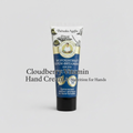 Hand cream tube with branding on a light gray background