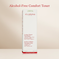 Clarins alcohol-free comfort toner packaging on a beige background