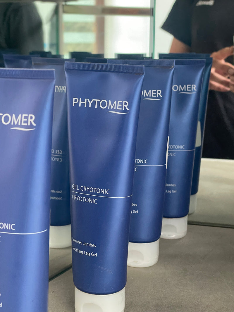 Row of Phytomer skincare products on a reflective surface