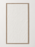 Ivory ribbed towel with taupe border measuring 72 x 133 cm on a light grey studio background