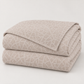 Pale blush beige mosaic textured bedspread 200 x 210 cm folded studio view