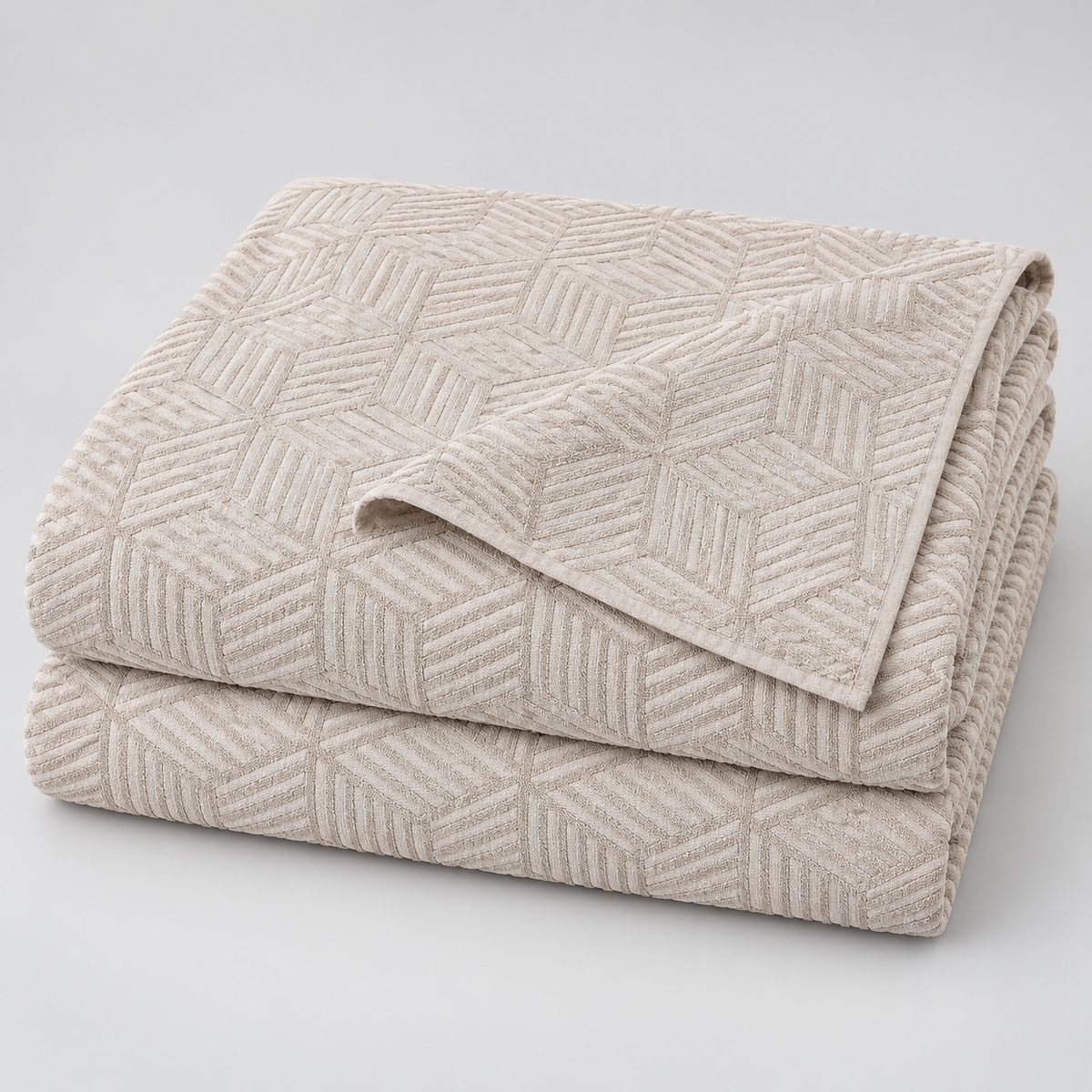 STIL CUBE beige cotton bedspread 220 x 240 cm folded studio view
