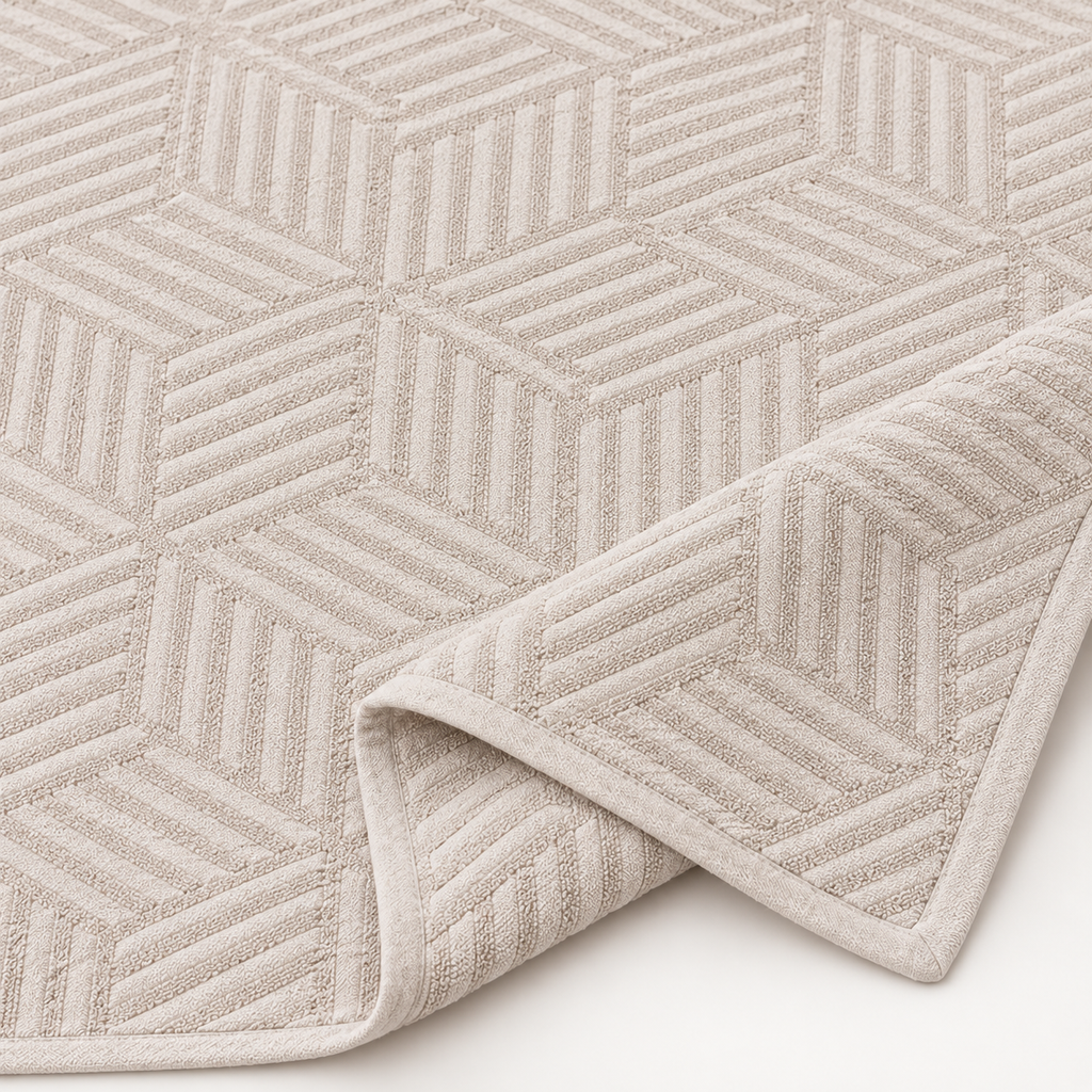 Close-up of STIL CUBE beige cotton bedspread geometric terry jacquard