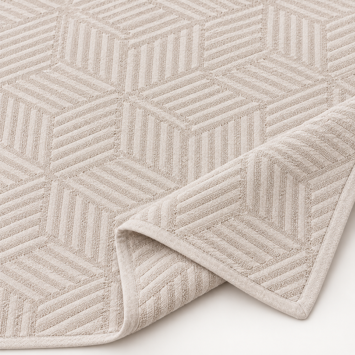 Close-up of STIL CUBE beige cotton bedspread geometric terry jacquard