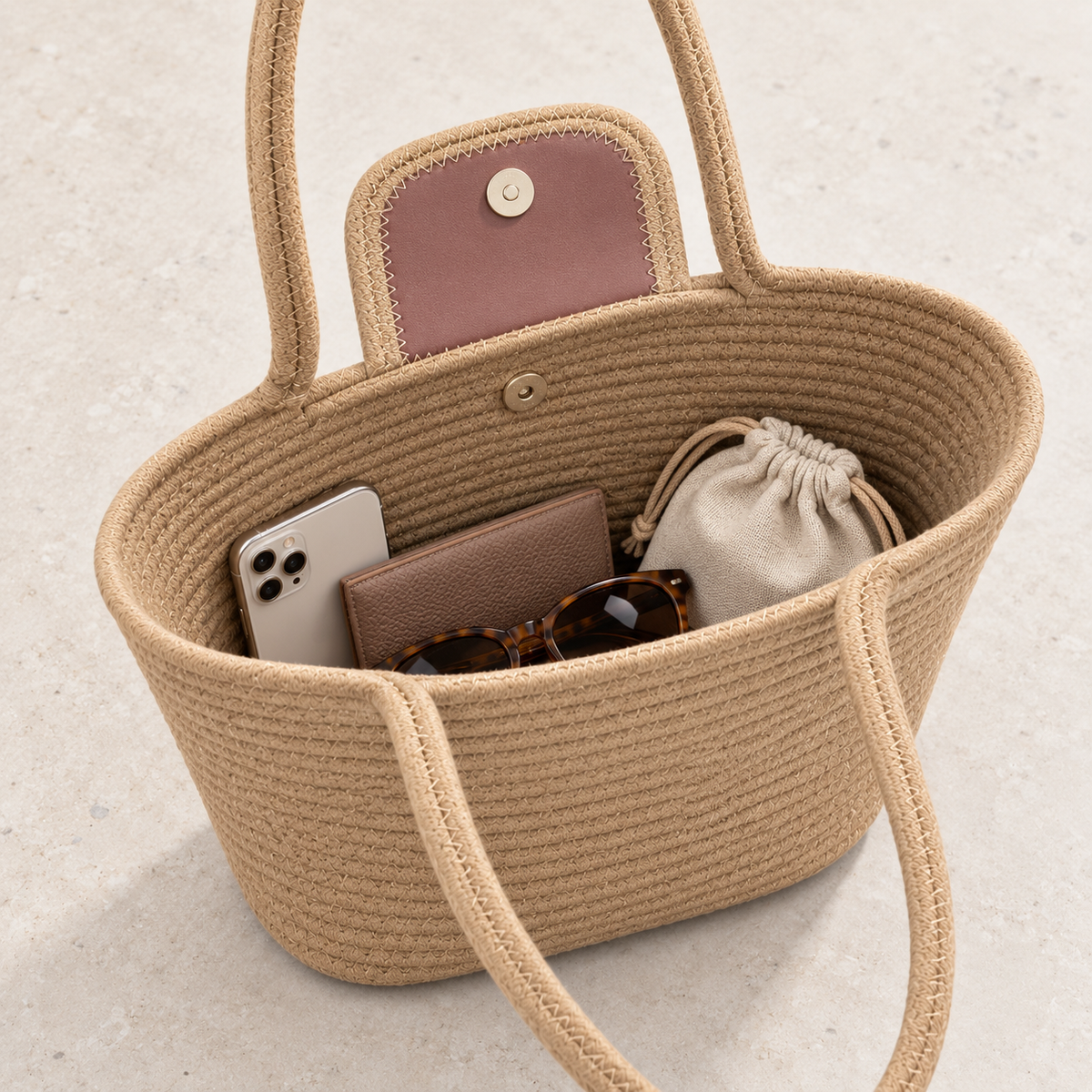 Open tan rope tote bag showing snap closure and everyday carrying capacity