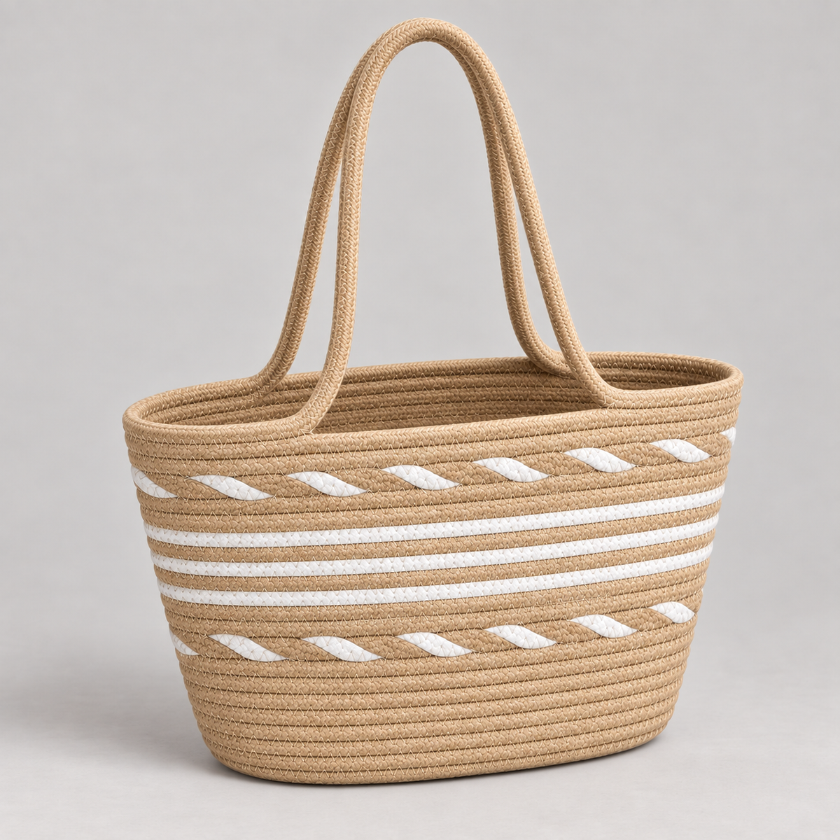 Tan and white coiled rope tote in three-quarter studio view